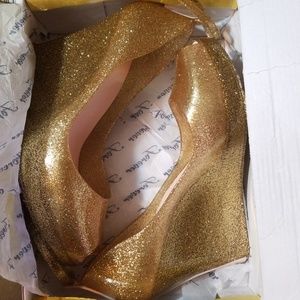 Wedges , pretty gold color , never worn them